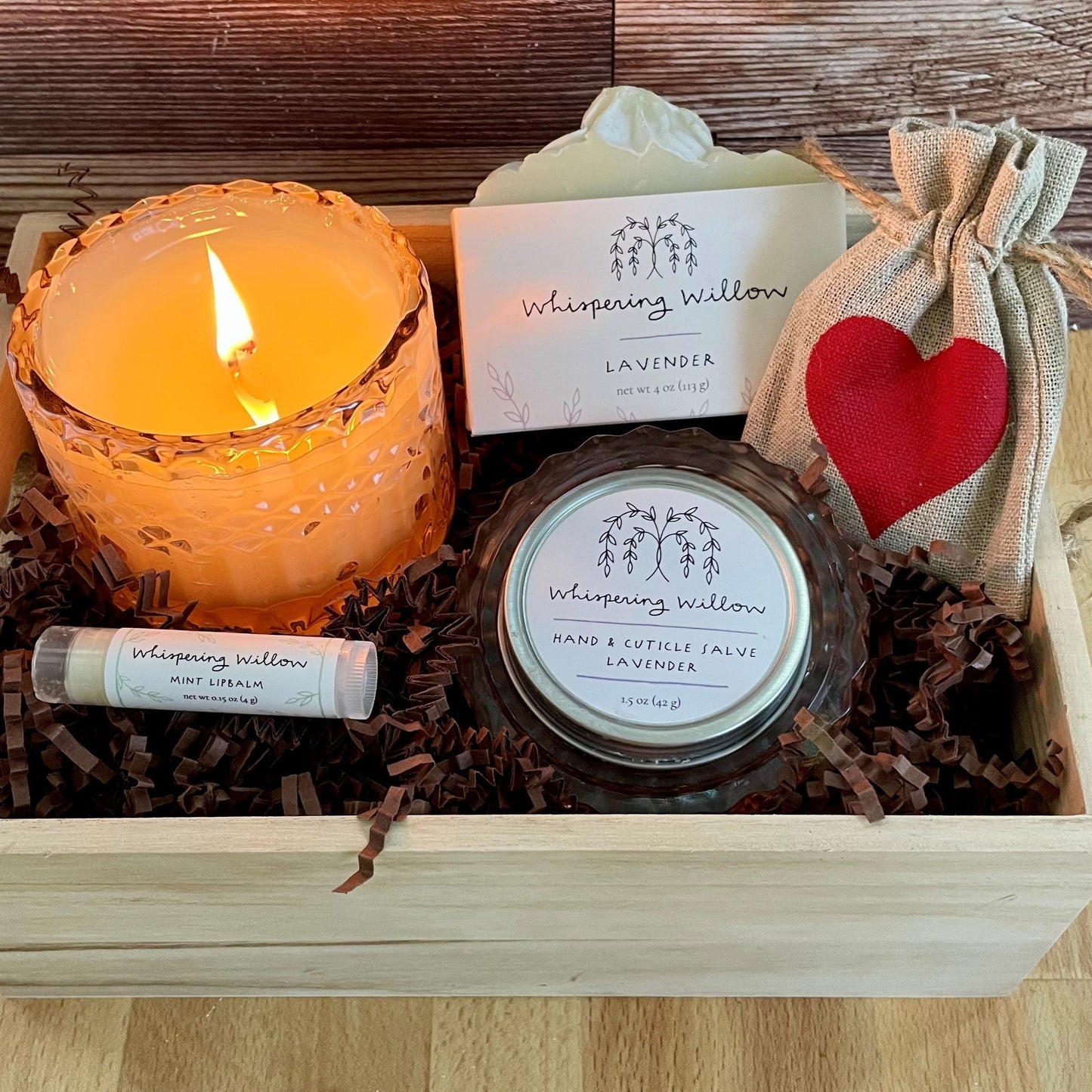 gift box for special person. Includes lavender handmade soap, shimmering candle, hand salve, lip balm and tea in a wood box with a card.