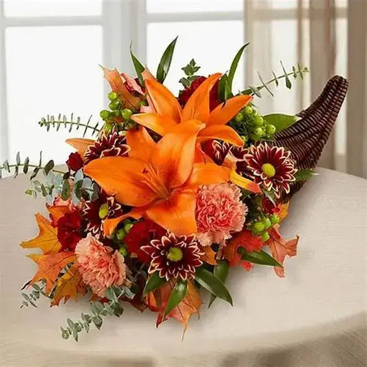Cornucopia Fall Flowers arrangement featuring orange lilies, multicolored mums, and festive foliage from Brentwood, CA 94513.