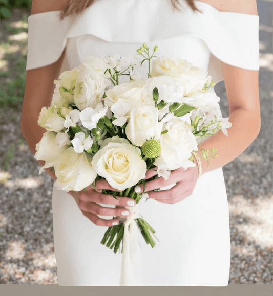 Elegant white wedding bouquet featuring roses and greenery, ideal for flower delivery Brentwood CA 94513.