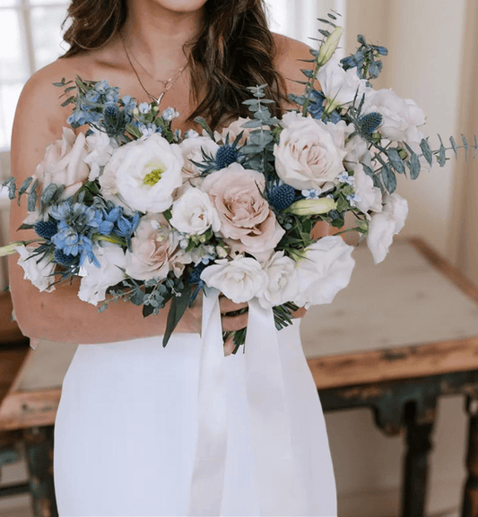Beautiful Pastel Wedding Bouquet featuring large garden roses, delphinium, and eucalyptus for weddings in Brentwood CA 94513.