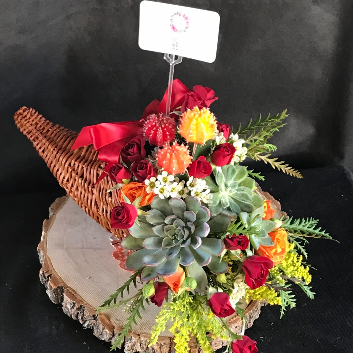 thanksgiving centerpiece a fun arrangement to send has both flowers and succulents in the arrangement very pretty and festive for the holiday