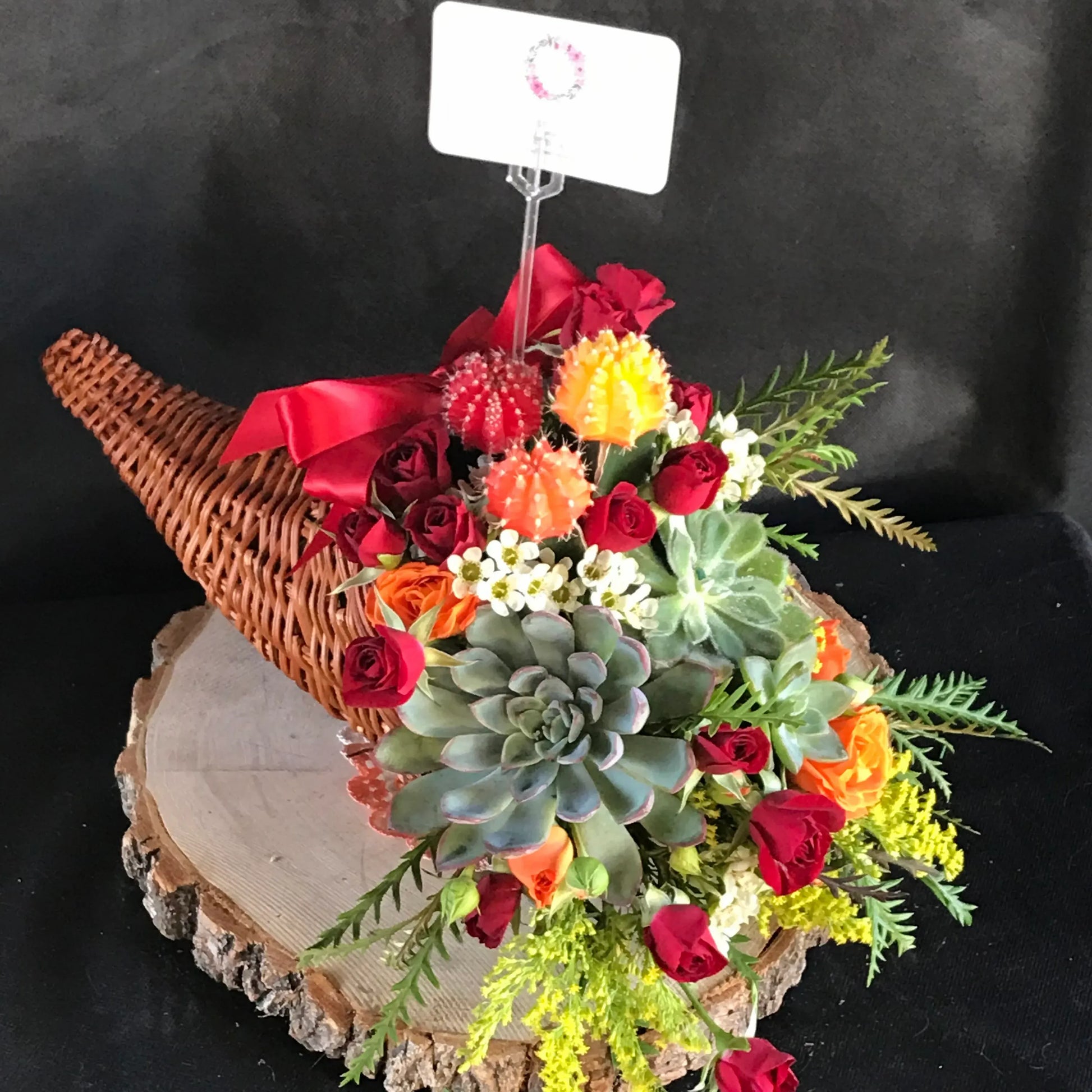 thanksgiving centerpiece a fun arrangement to send has both flowers and succulents in the arrangement very pretty and festive for the holiday
