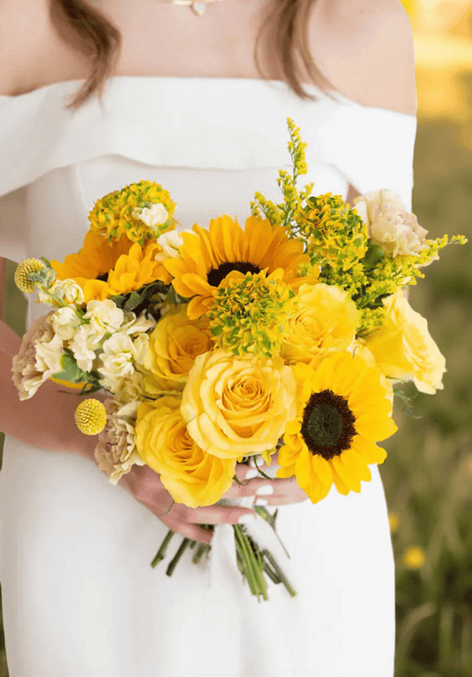 Sunshine Wedding Bouquet with bright yellow roses and sunflowers for flower delivery Brentwood CA 94513.